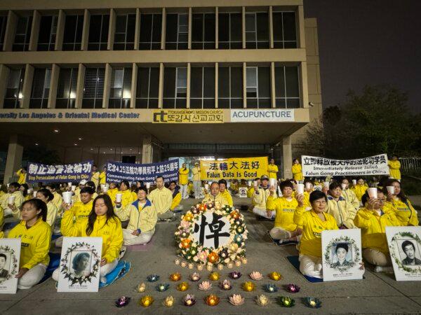 Falun Gong adherents hold a candlelight vigil in front of the Chinese Consulate to mark the 25th anniversary of a peaceful appeal by 10,000 people in China in Los Angeles on April 21, 2024. (Linda Jiang/The Epoch Times)