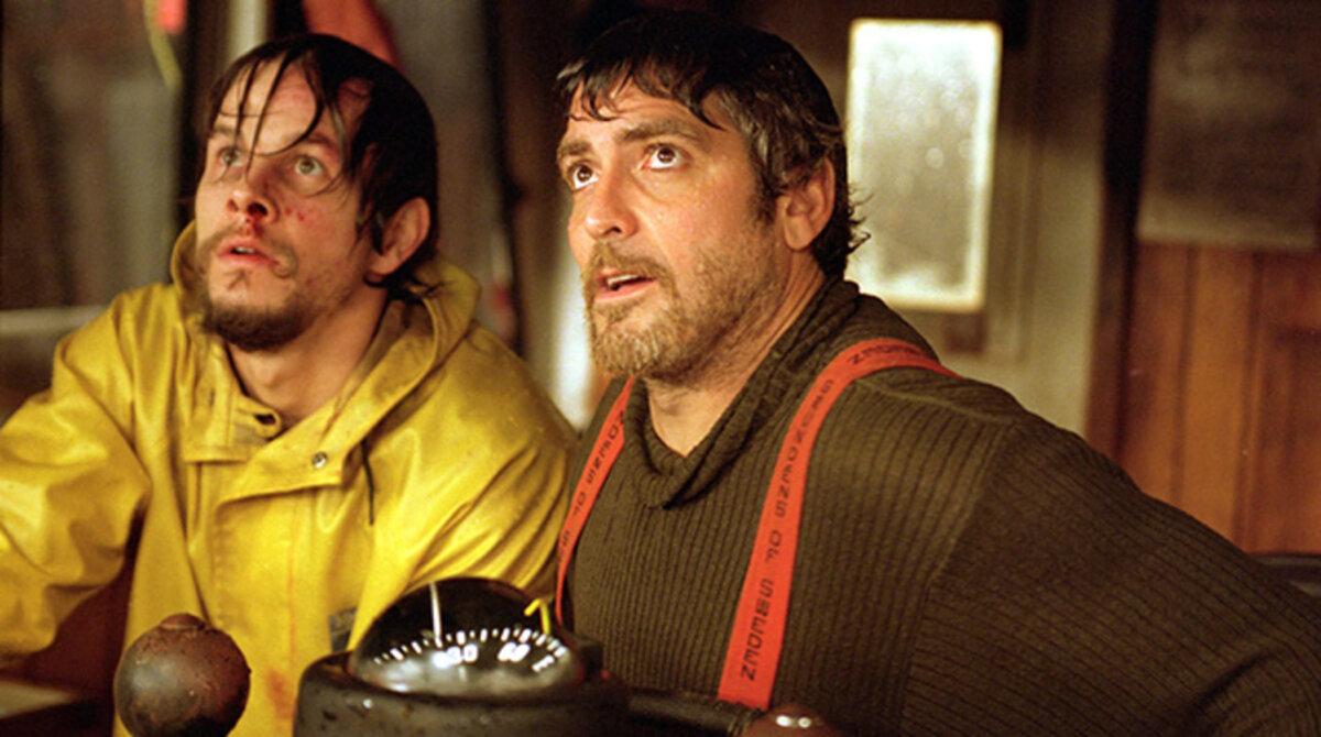 Bobby Shatford (Mark Wahlberg, L) and Capt. Billy Tyne (George Clooney) face the elements together, in “The Perfect Storm.” (Warner Bros.)