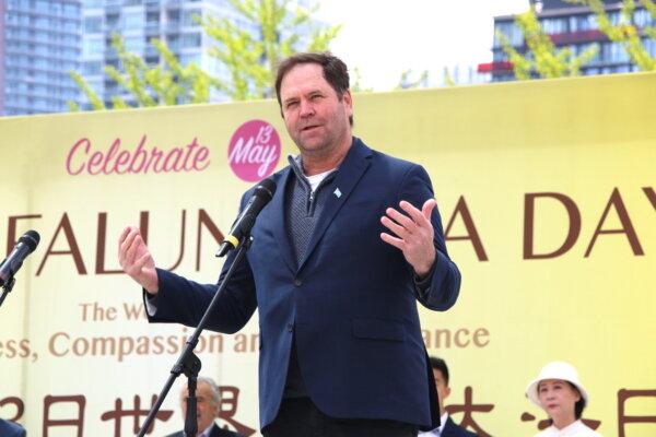 Dean Baxendale, president and publisher of Optimum Publishing International, speaks during a rally outside Toronto City Hall, where hundreds of Falun Gong adherents gathered to celebrate the 32nd World Falun Dafa Day on May 11, 2024. (Andrew Chen/The Epoch Times)