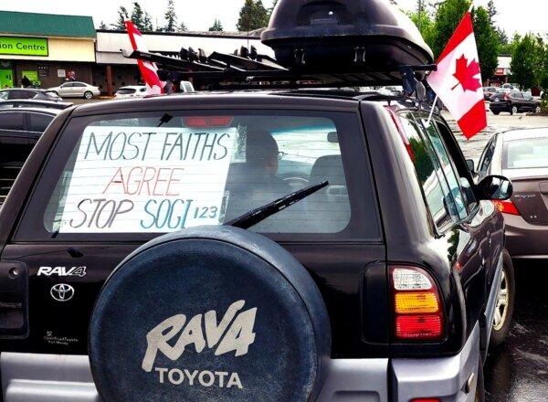 A vehicle adorned with Canadian flags and displaying a sign reading "Most faiths agree stop SOGI 123," was seen participating in a car rally held in Abbotsford, B.C., on June 1, 2024. The event opposes gender ideology curriculum in schools. (The Epoch Times)