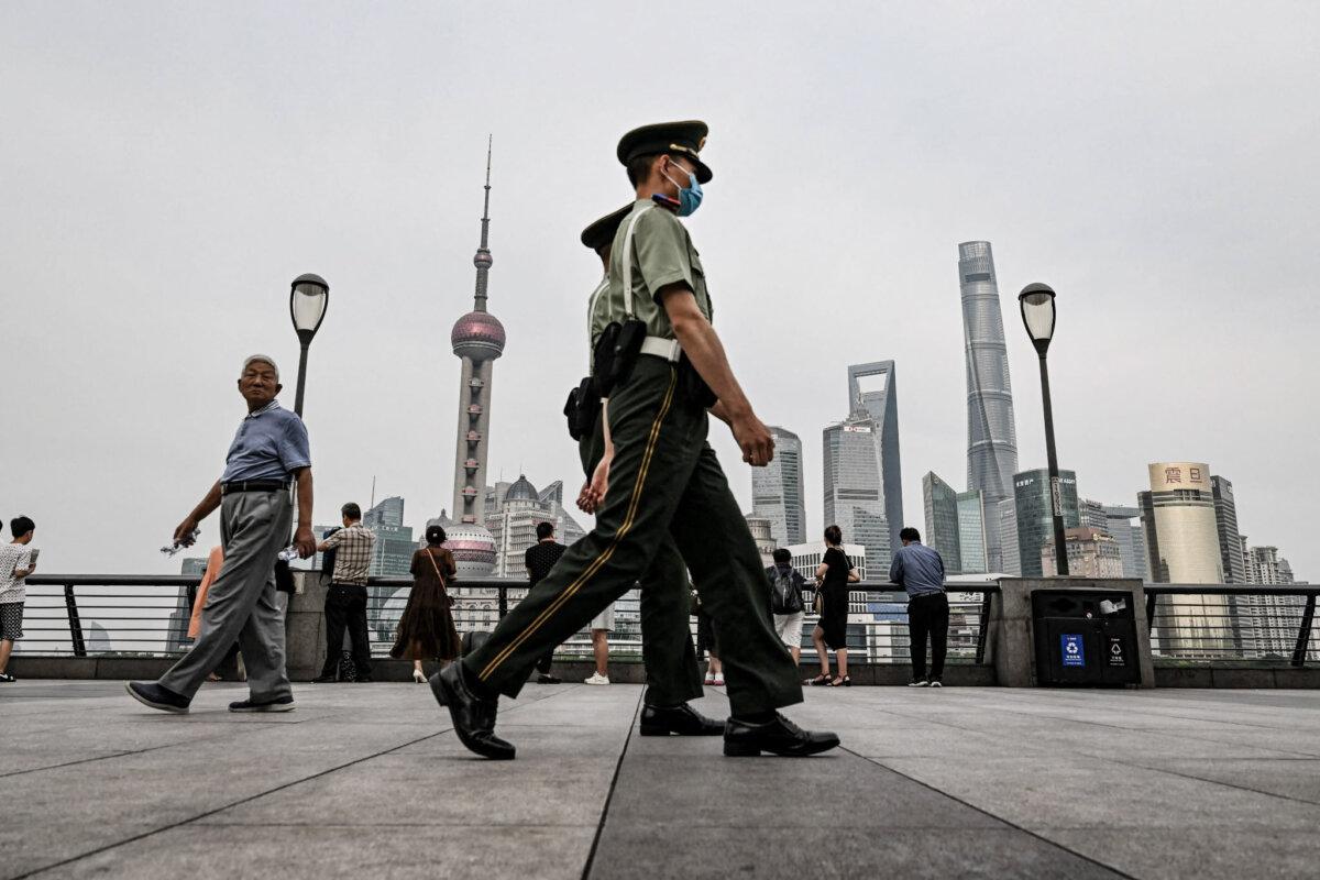 Chinese paramilitary police patrol in Shanghai, China, on June 15, 2023. (Hector Retamal/AFP via Getty Images)