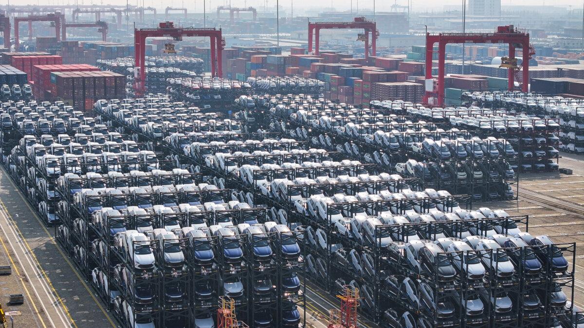 Electric cars waiting to be loaded onto a ship are seen stacked at the international container terminal of Taicang Port in Suzhou, in China's eastern Jiangsu Province, on Feb. 8, 2024. (STR/AFP via Getty Images)