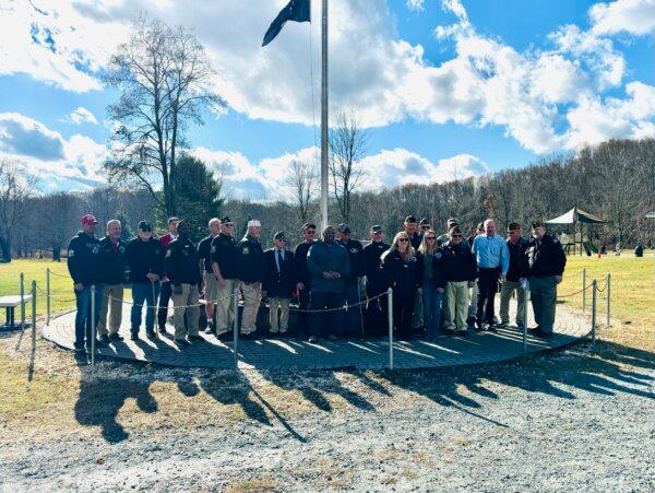Local veterans pose with Mount Hope town officials and Otisville village officials in Veterans Memorial Park in Otisville, N.Y., on Nov. 11, 2024. (Cara Ding/The Epoch Times)