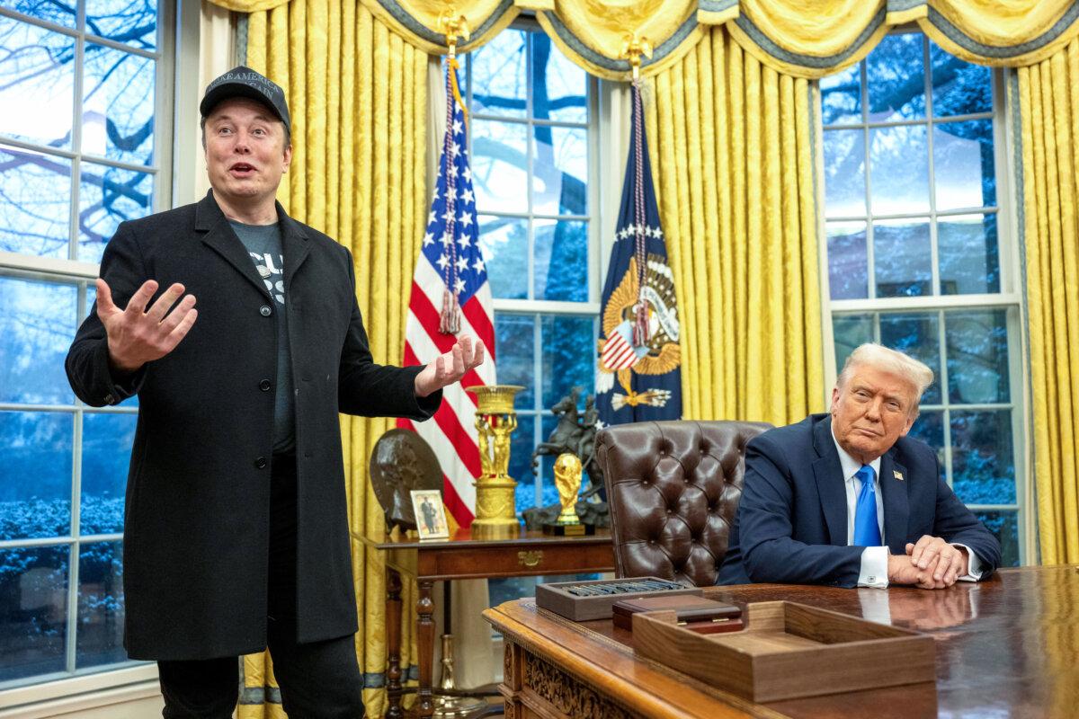Elon Musk (L) speaks as President Donald Trump looks on in the Oval Office of the White House on Feb. 11, 2025. (Jim Watson/AFP via Getty Images)