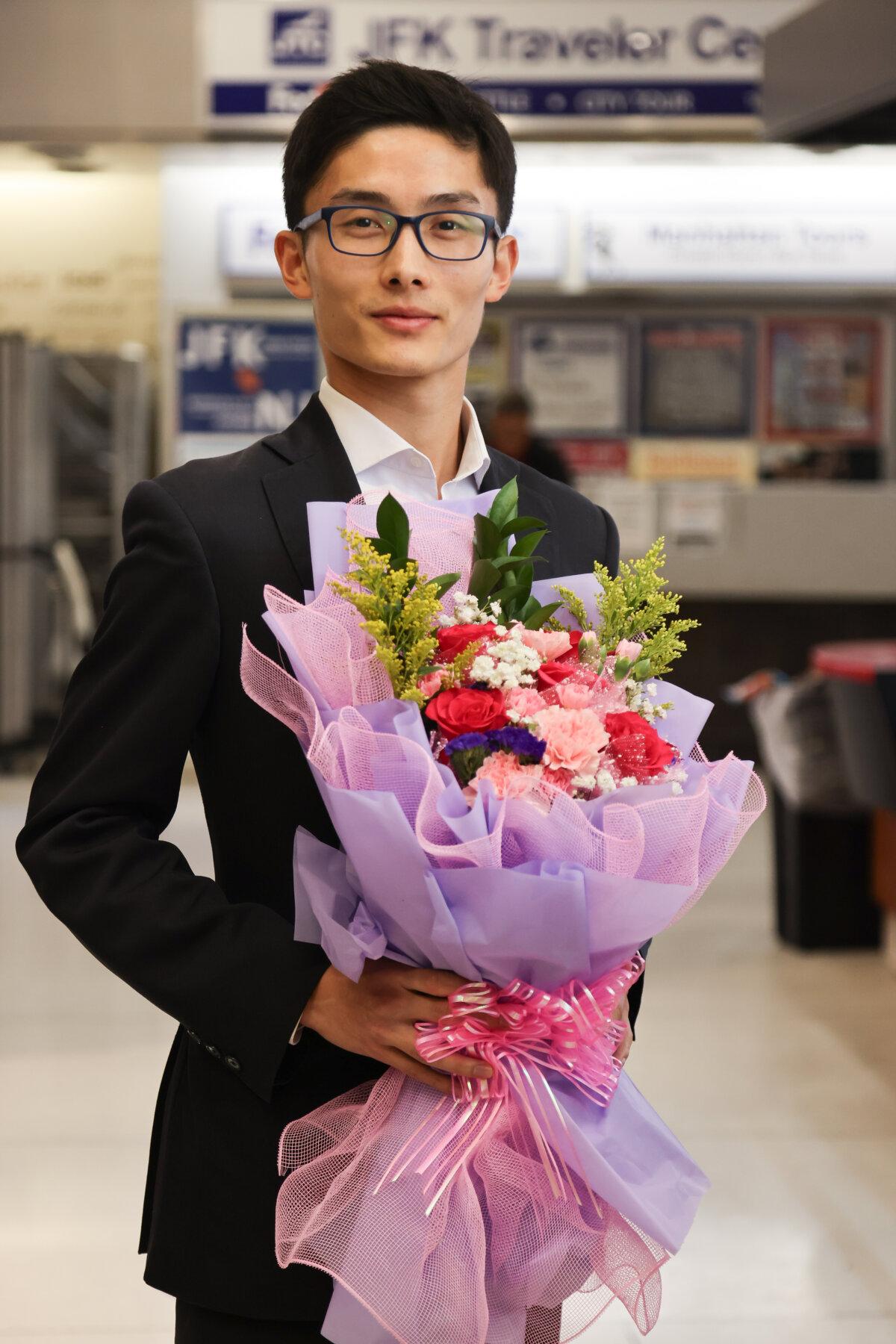 Shen Yun Performing Arts principal dancer Sun Hongwei is welcomed back after a tour at JFK airport in New York City in May 2025. (Courtesy of Benny Zhang)