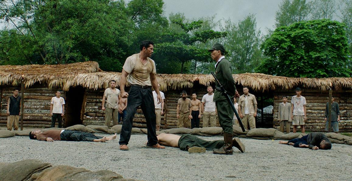 Amid fallen guards, Wing Cmdr. James Wright (Scott Adkins, L) faces Lt. Col. Ito (Peter Shinkoda), in "Prisoner of War." (Well Go USA)