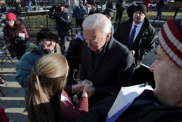 Democratic presidential candidate former Vice President Joe Biden embraces a supporter outside the New Hampshire State House after he filed to have his name listed on the New Hampshire primary ballot, on Nov. 8, 2019. (Charles Krupa/AP Photo)