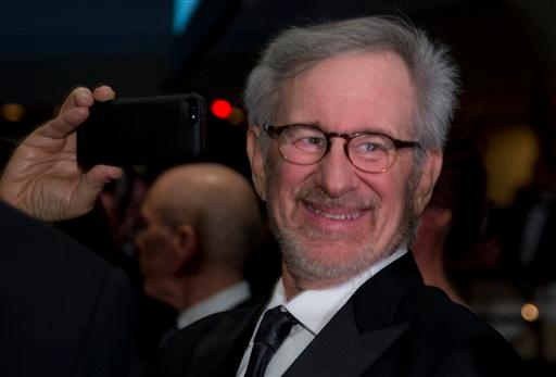 Director Steven Spielberg uses his smart phone during the White House Correspondents' Association Dinner at the Washington Hilton Hotel, Saturday, April 27, 2013, in Washington. (AP Photo/Carolyn Kaster)
