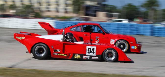 This disparate pair, the #94 1994 Chevron B23/36 and the #5 1976 Porsche 935/K1, dueled for several laps Saturday before the Porsche collided with a Corvette, sidelining both cars. (Chris Jasurek/Epoch Times)