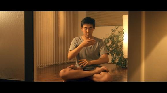 Eric doing the Falun Gong meditation exercise at home in Sydney, Australia. China is the only country in the world that doesn't allow Falun Gong practitioners to meditate freely. (Alexander Nilsen)