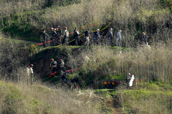 Investigators work the scene of a helicopter crash that killed former NBA basketball player Kobe Bryant in Calabasas, Calif., on Jan. 27, 2020. (Mark J. Terrill/AP Photo)