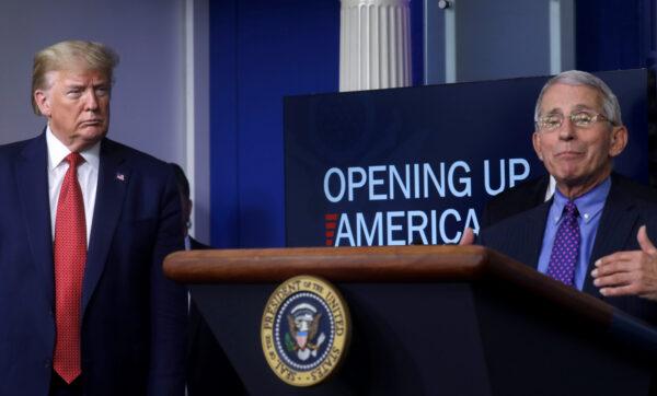 President Donald Trump listens to Dr. Anthony Fauci discuss the Trump administration's guidelines for "Opening Up America Again" during the daily coronavirus task force briefing at the White House in Washington, on April 16, 2020. (Leah Millis/Reuters)