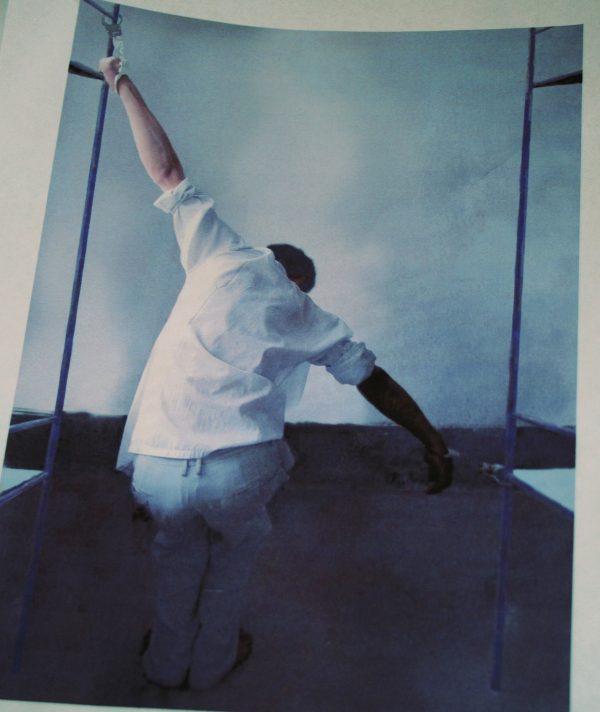 Falun Gong practitioner Chunying Wang, who was held at the Masanjia Labor Camp in northeastern China for a total time of five years seven months, used this photo to demonstrate the torture she endured. She spoke at the Washington Press Club on April 24, 2013. (Gary Feuerberg/ The Epoch Times)