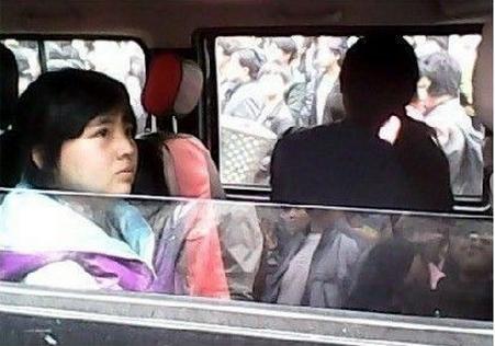 Young Girl Cuffed and Paraded Through Streets by Official in China