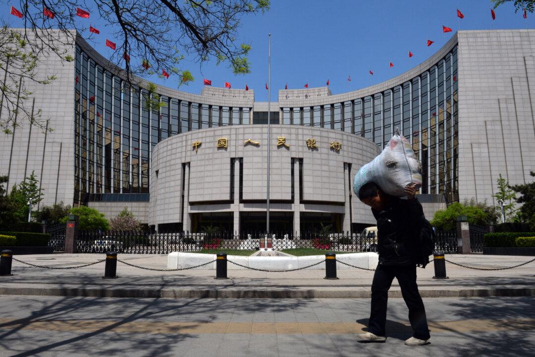 China Cuts Key Interest Rate Amid Property Slump, Currency Risks