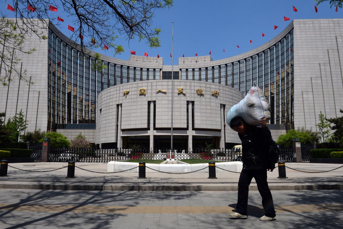 China Cuts Key Interest Rate Amid Property Slump, Currency Risks