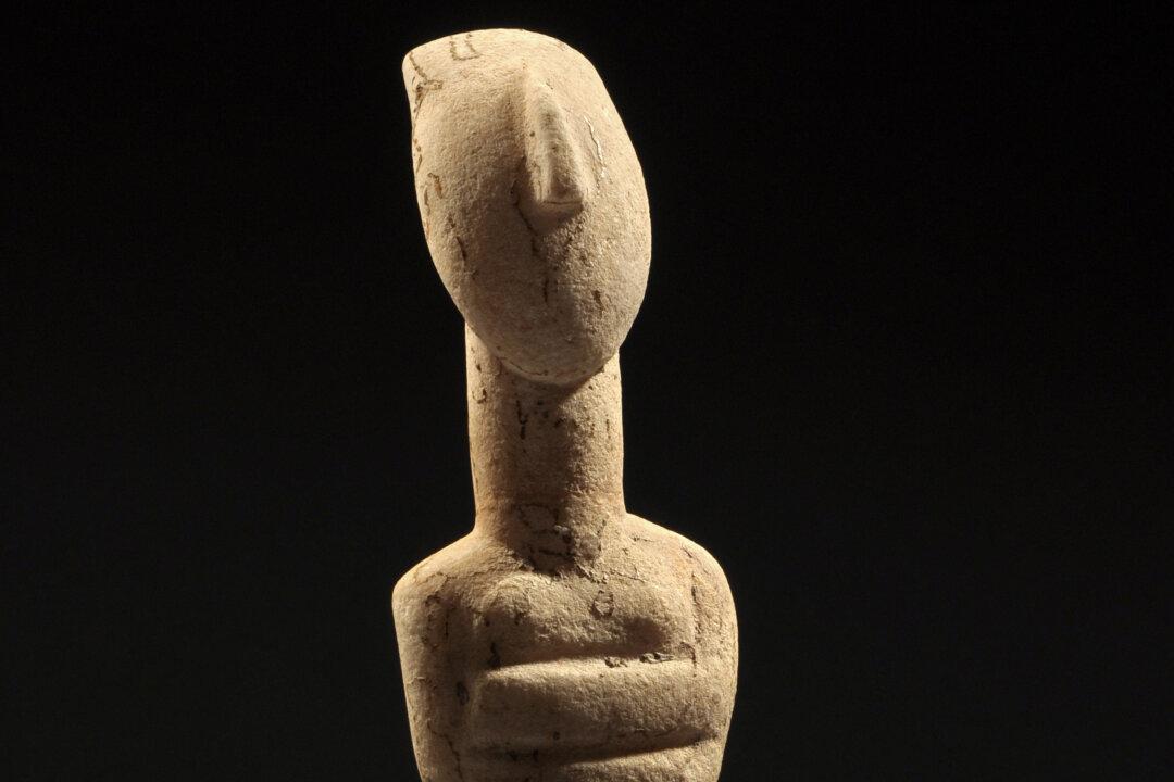 A Reclining Female Cycladic Marble Idol