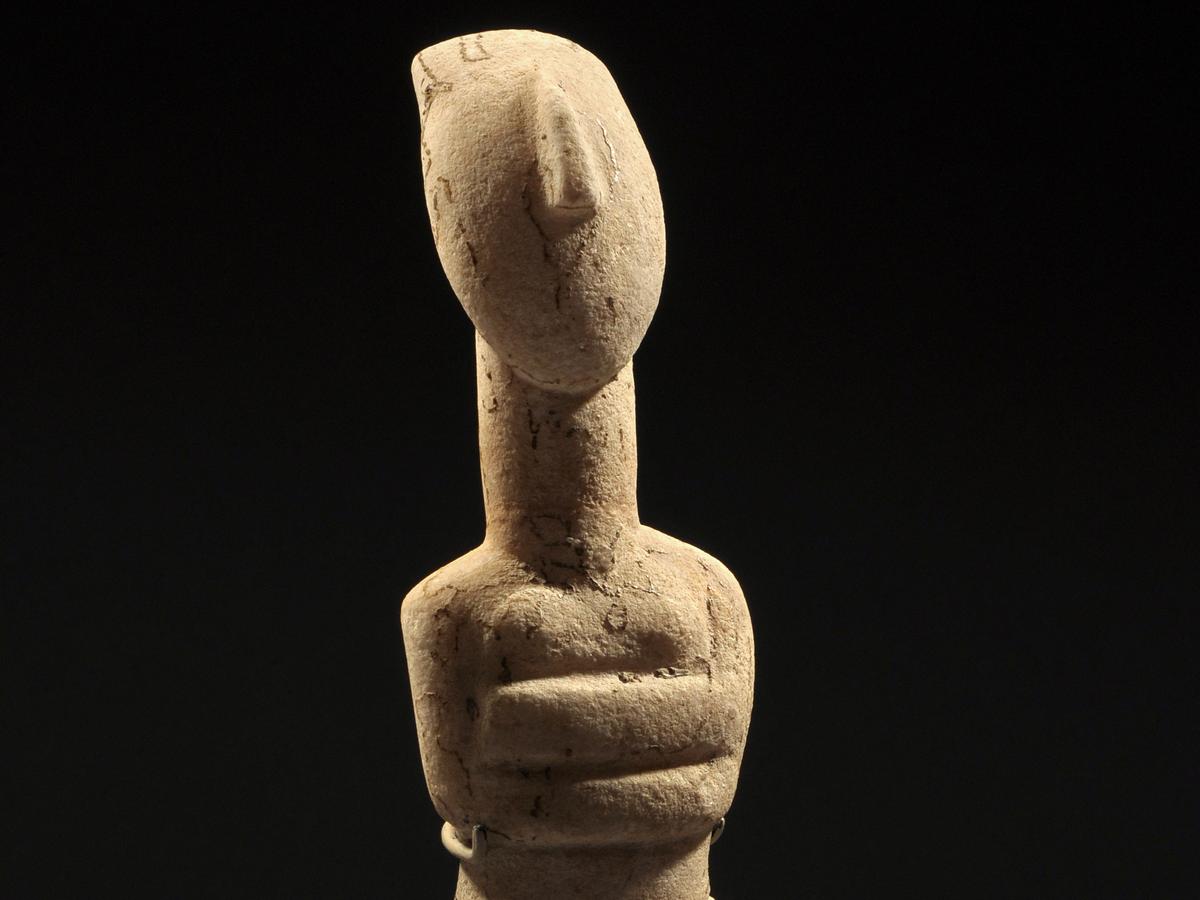A Reclining Female Cycladic Marble Idol