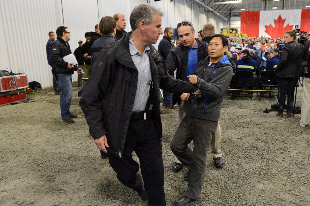 Harper’s Northern Tour Ends with Tussle Involving Chinese Reporter