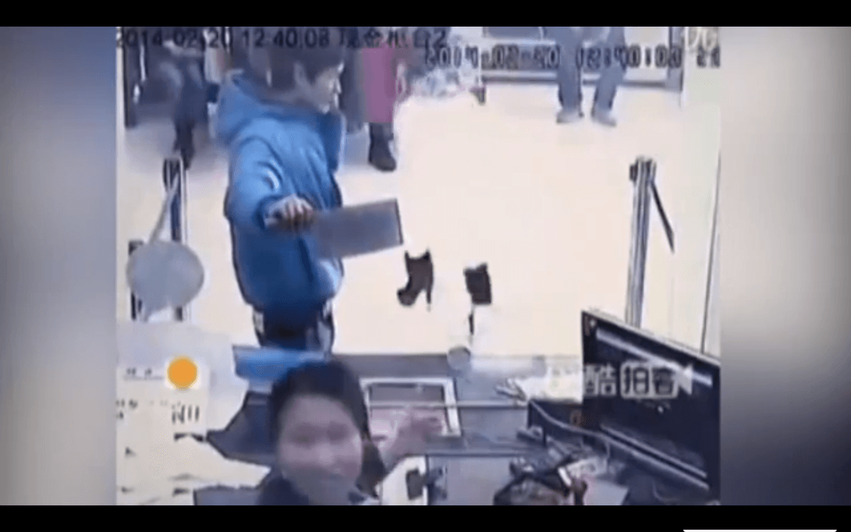 Video: Bank Teller Laughs at Knife-Wielding Robber in China