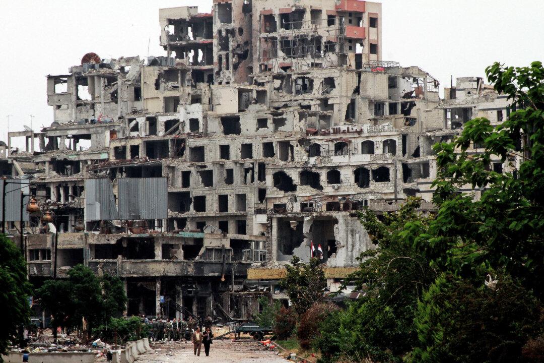 2 Bombs Hit Central Syria City of Homs, Wounding at Least 32