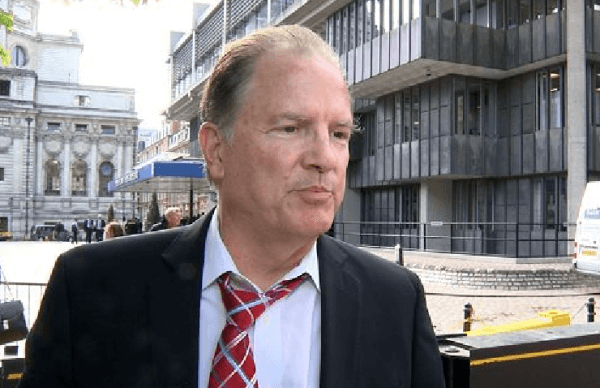 Dr. Howard P. Monsour, chief of Hepatology at Houston Methodist Hospital in Houston, Texas, outside of London's Queen Elizabeth II Conference Centre where the 2014 Joint International Congress on Organ Transplants was held on June 4-7, 2014. (Coutesy of Minghui)