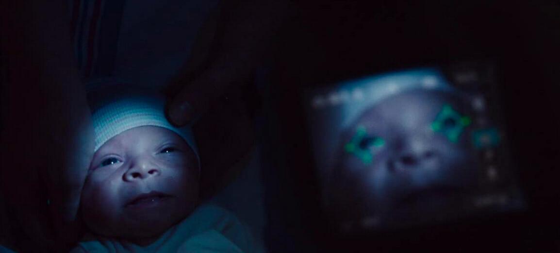 The son of Ian (Michael Pitt) and Karen (Brit Marling) is subjected to eye-scanning, in "I Origins." (Fox Searchlight Pictures)