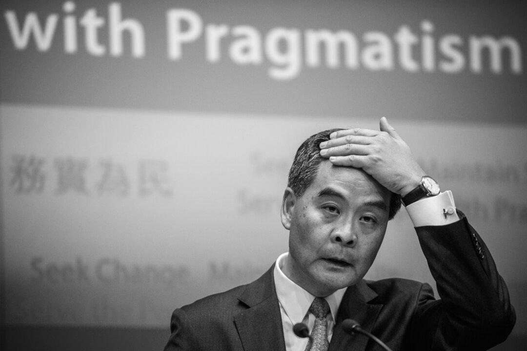 Chinese Officials Tame Hong Kong Leader