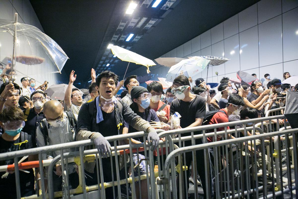 Hong Kong Protesters Storm Key Tunnel in Retaliation for Police Seizure of Road
