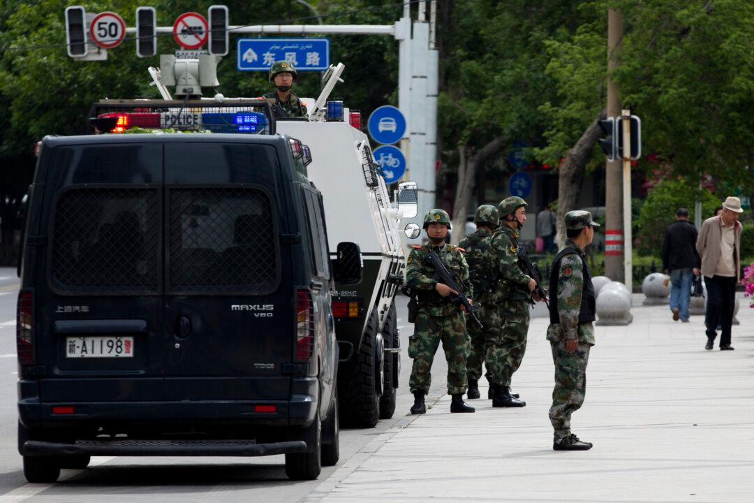 Human Rights Group: 100,000 Chinese Troops Likely to Be Stationed in Xinjiang