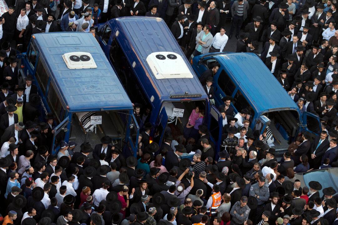 A Look at Victims, Assailants in Jerusalem Synagogue Attack