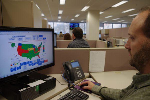 A researcher simulates a check done for the National Instant Criminal Background Check System or NICS, at the FBI’s criminal justice center in Bridgeport, W.Va., on Nov. 18, 2014. (Matt Stroud/AP Photo)