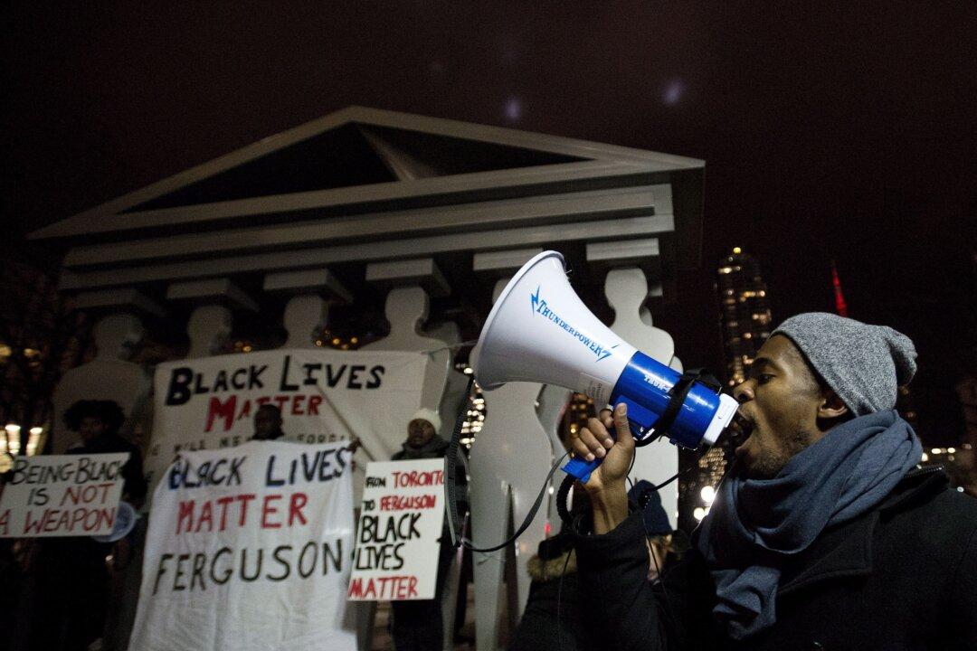 Thousands Hold Vigil in Toronto for Slain Ferguson Teenager