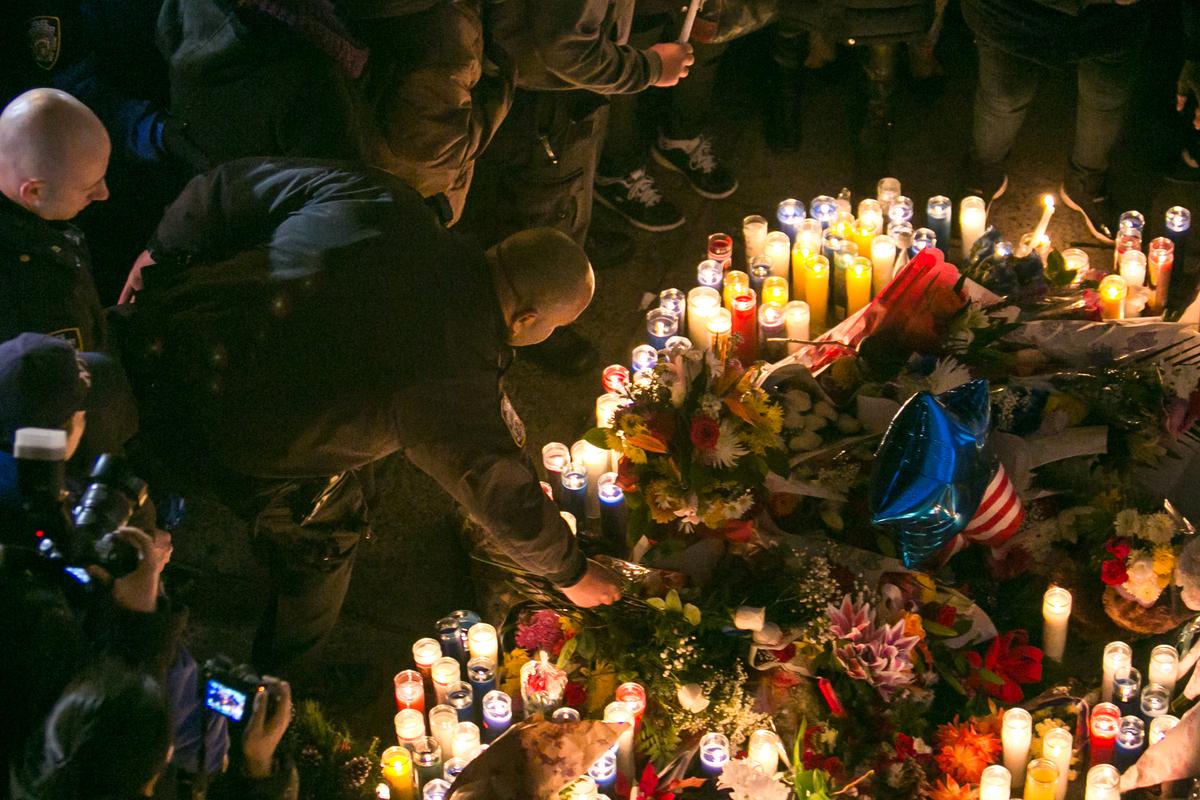 Candlelight Vigil for Slain Cops Honored by Protesters and Police Alike