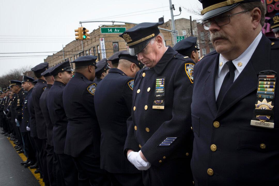Mayor Eulogizes Officer as Cops Outside Turn Backs
