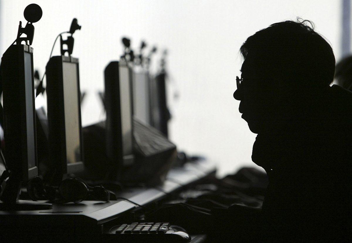 A person uses a computer in an internet cafe in Shenyang, China, in this file photo. (AP Photo)