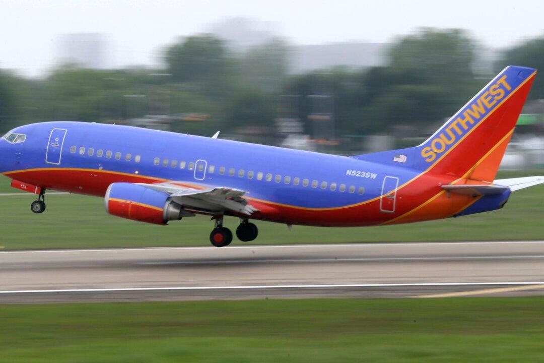 Southwest Flight Attendant Holds Crying Baby in Viral Video