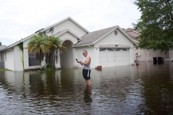 Residents of the Mill Run area prepare to leave under a mandatory evacuation order by emergency management officials on June 26, 2012, in New Port Richey, Florida. According to local news, two area rivers converged and surpassed the 100-year flood plan. (Edward Linsmier/Getty Images)
