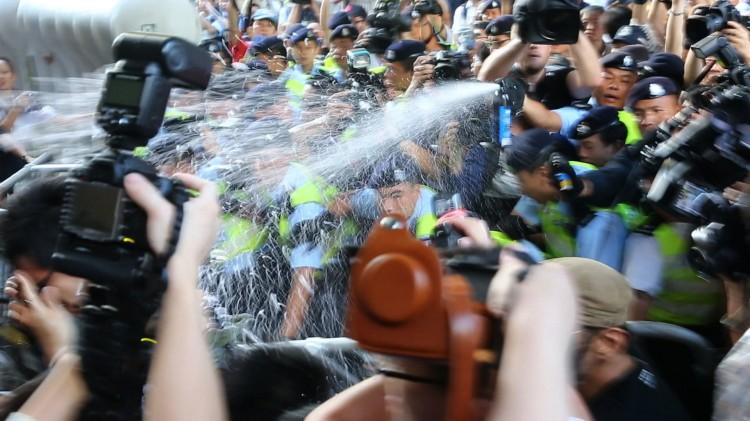 Police Pepper Spray Protestors During Hu Jintao’s Hong Kong Visit