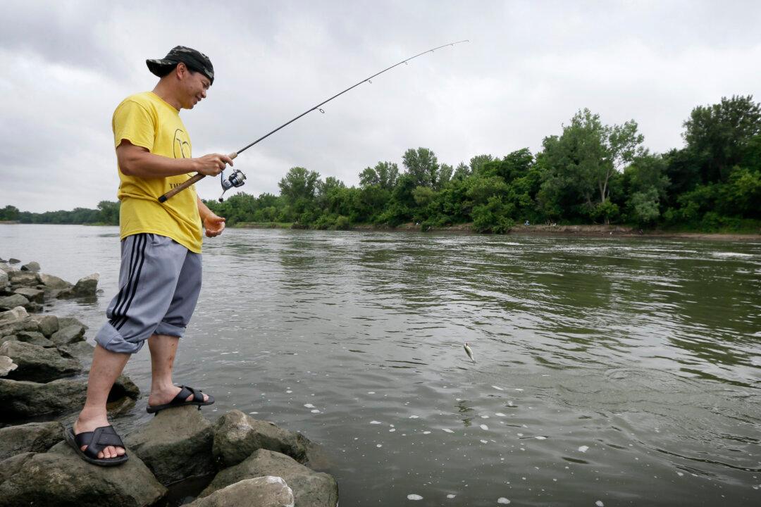 Poor, Immigrants Fish for Their Dinner, Unaware of Risks