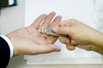 At trade fairs, giveaways such as USBs may be loaded with spyware by Chinese government hackers. (Seth Holehouse/The Epoch Times)