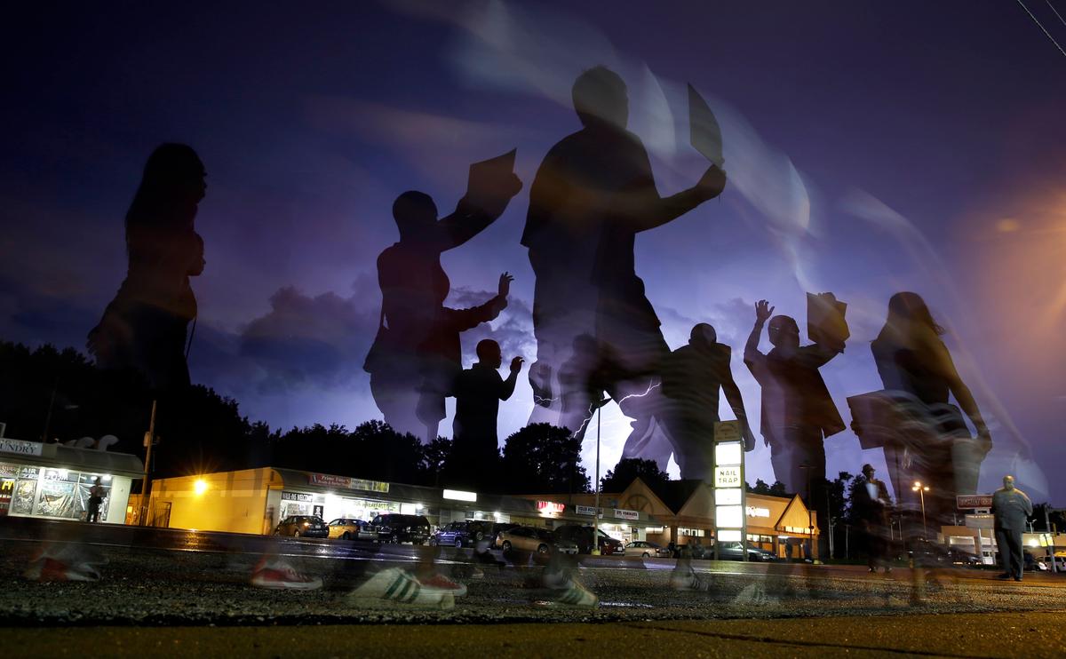 March, Moment of Silence Mark Anniversary in Ferguson