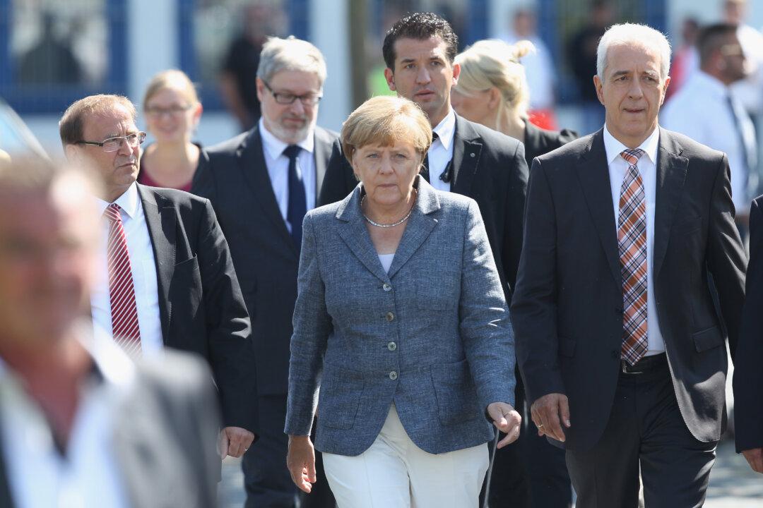 Merkel Travels to Far-Right Heartland to Defend Refugees