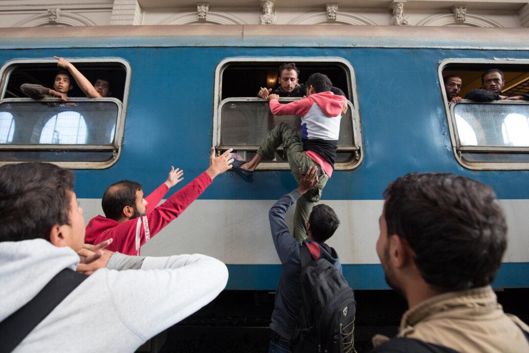 Hungary Opens Door to Trains for Migrants, but Only to Camps