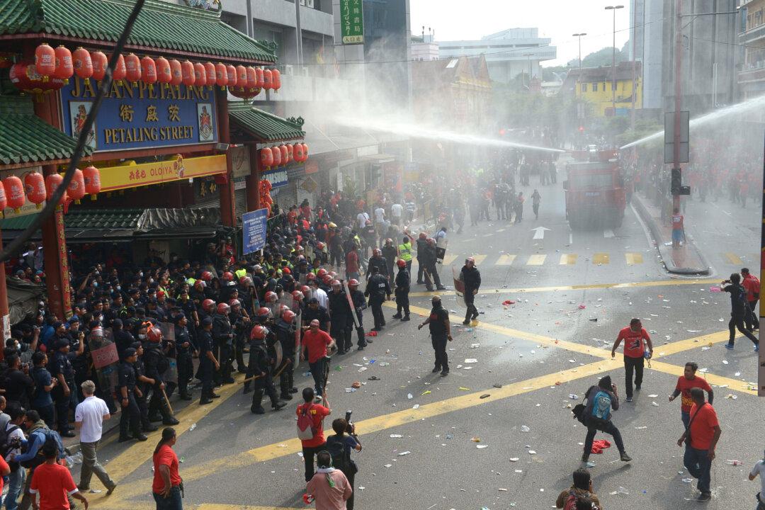Malaysian Police Fire Water Cannons at Malay Protesters