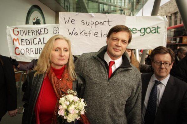 Dr. Andrew Wakefield walks with his then-wife Carmel after speaking to reporters at the General Medical Council in London on Jan. 28, 2010. (Peter Macdiarmid/Getty Images)