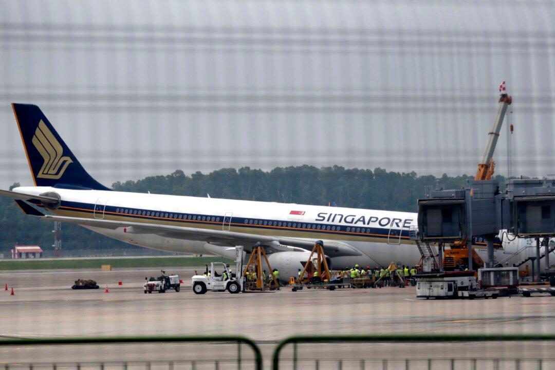 Singapore Airlines Jet Collapses During Checks, but No Injuries