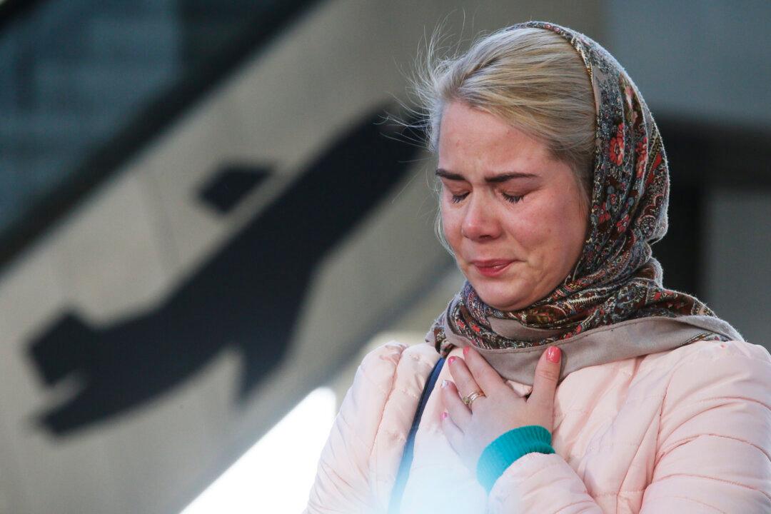 Tearful Relatives Identify Victims of Plane Crash
