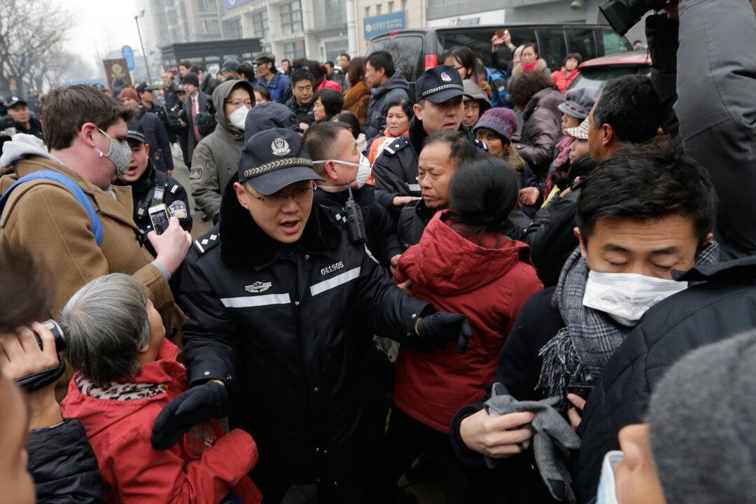 Lawyer on Trial in Beijing as Police Scuffle With Protesters