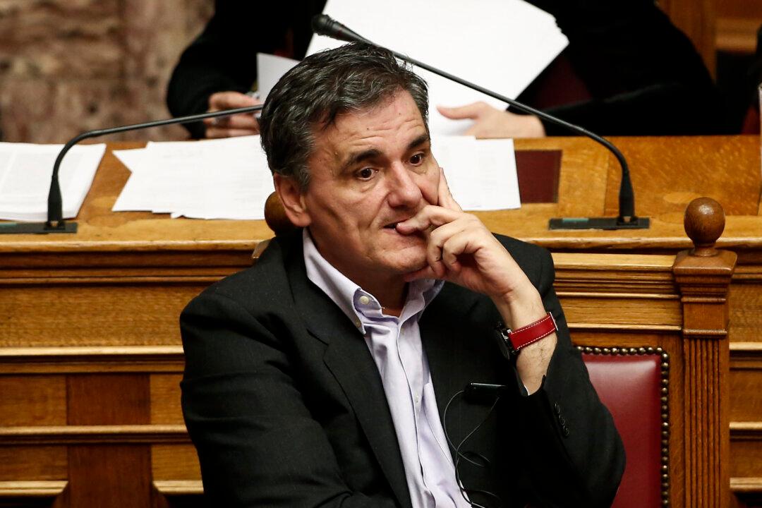 Greece Approves New Austerity Bill Changing Loan Rules